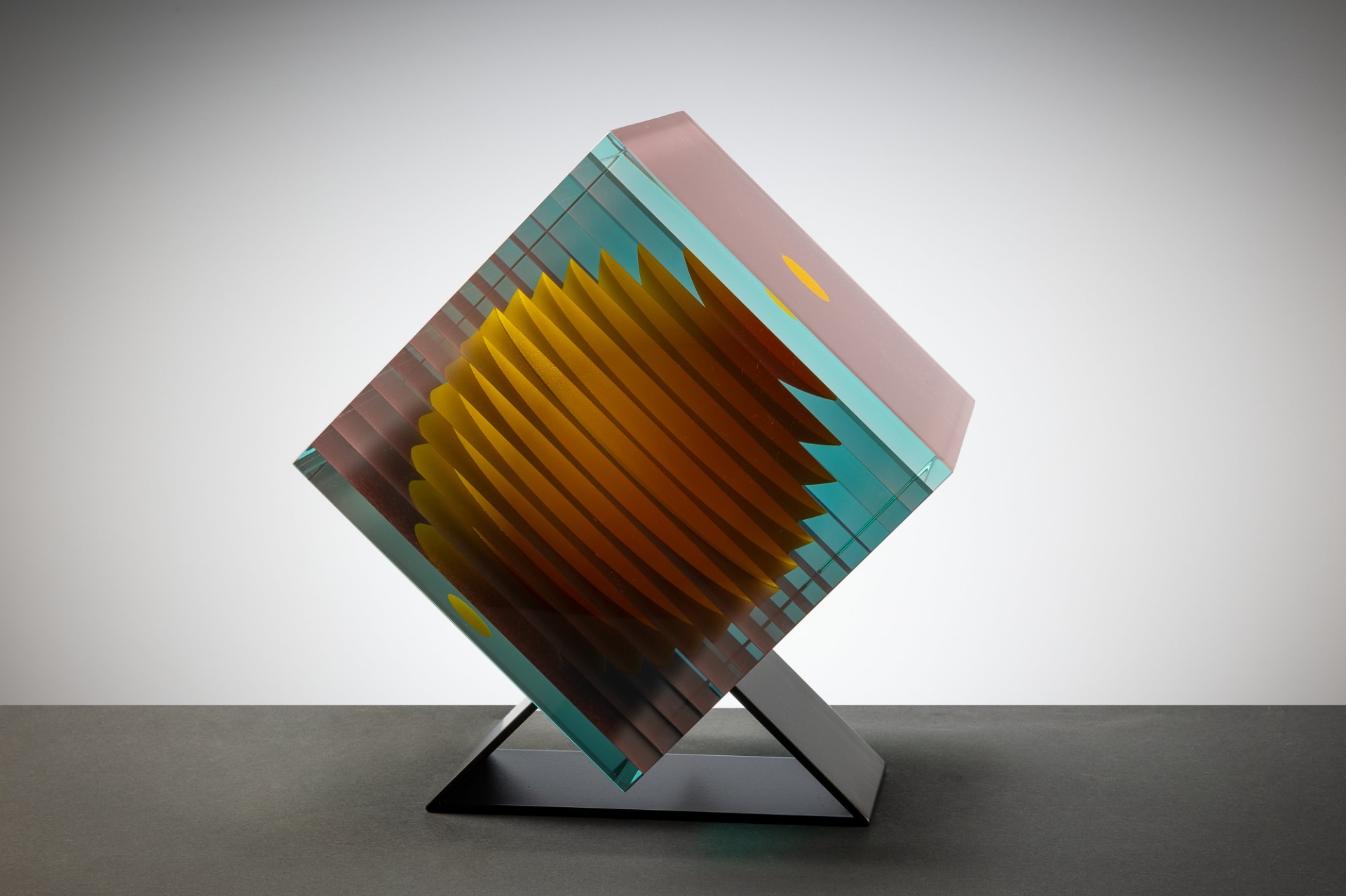 Contemporary glass sculpture by Wesley Neal Rasko exploring balance, rotation, and optical depth through geometric architectural glass forms