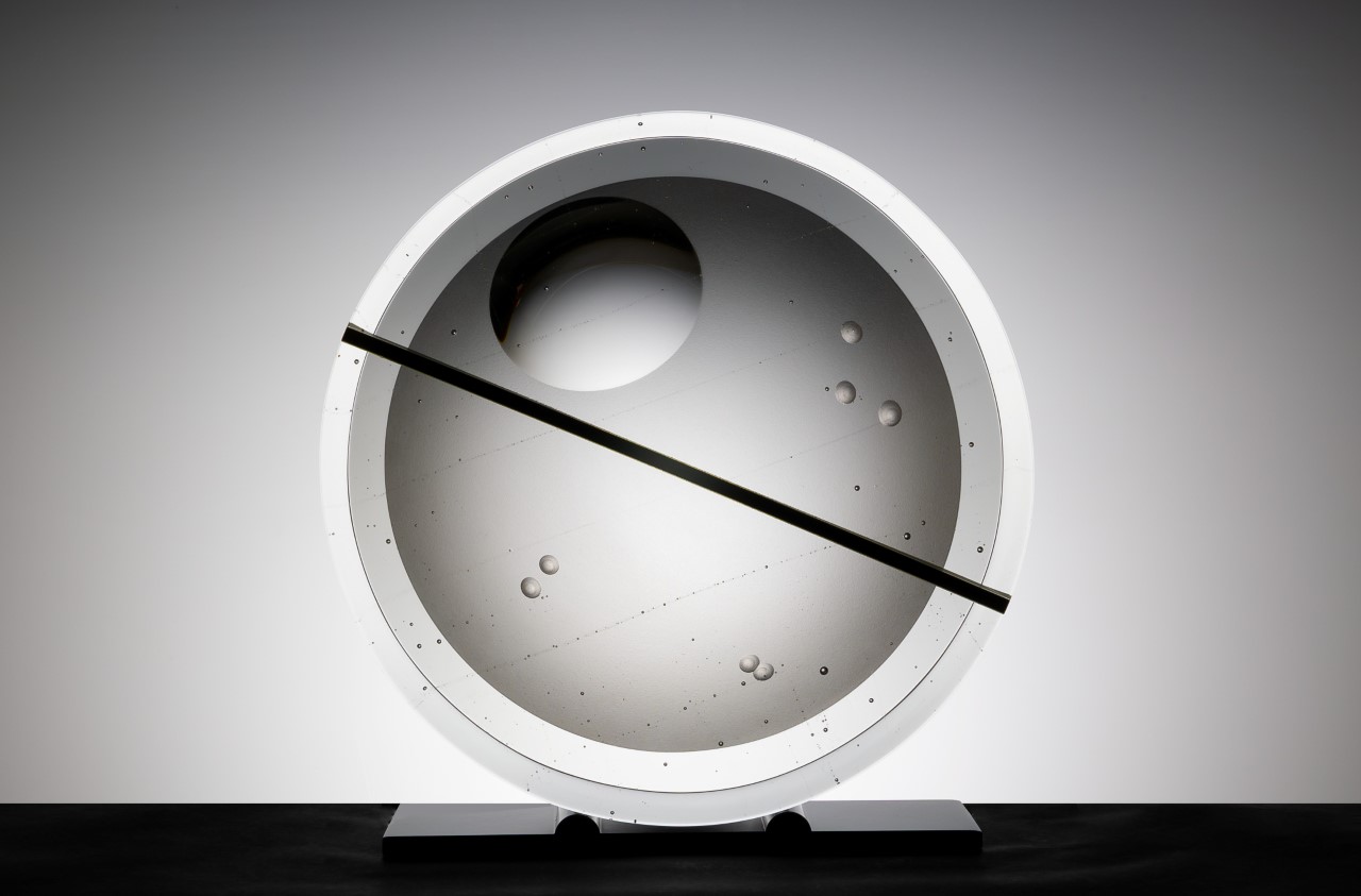 Circular contemporary glass sculpture by Wesley Neal Rasko exploring rhythm, balance, and optical depth through layered architectural glass forms