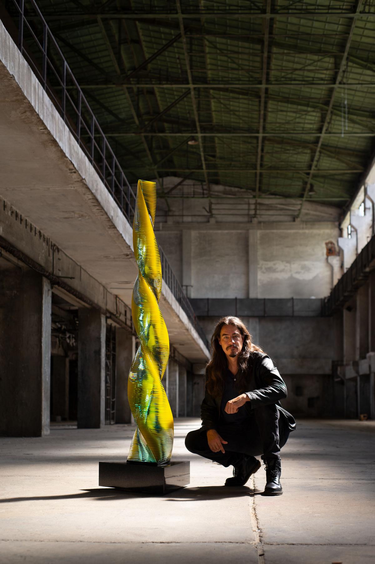 Twisted contemporary glass sculpture by Wesley Neal Rasko exploring movement, tension, and spatial flow through layered architectural glass forms